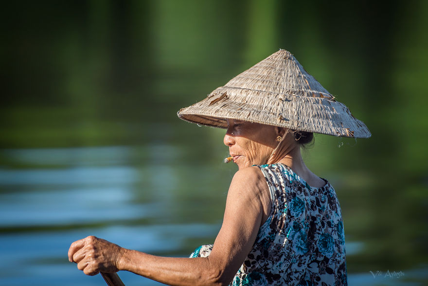 Woman on Perfume River in Hue, Vietnam. ( Photo by Veli Aydogdu )